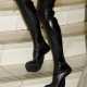 Gravity defying shoes - Victoria 'Posh Spice' Beckham's thigh-high PVC boots...with no heels!  1